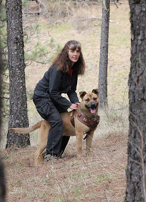 Ronda Bowser outdoors with a working dog